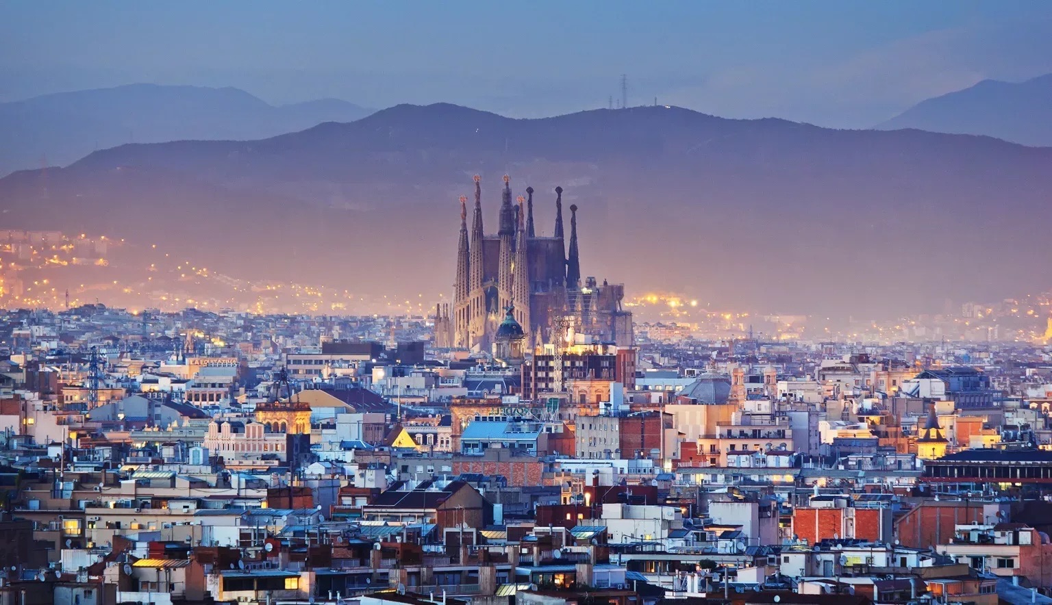 Barcelona skyline at dusk with the Sagrada Família